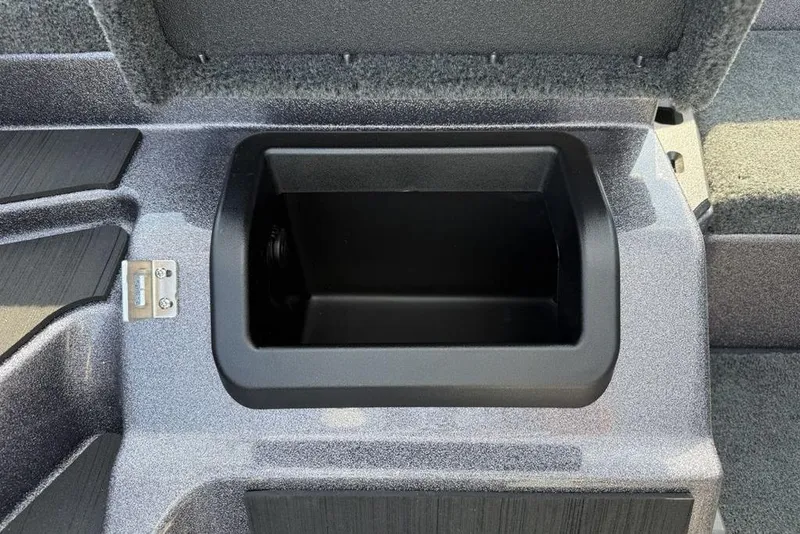 Slide: The Image of Storage compartment in 2026 Skeeter ZXE20 boat, open lid view. - 8