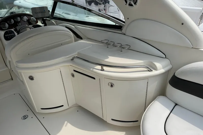 Slide: The Image of Interior of a 2005 Sea Ray 290 SLX boat, featuring a sleek white design. - 10