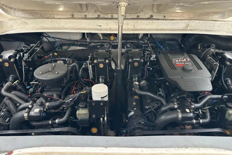 Slide: The Image of Engine compartment of a 2005 Sea Ray 290 SLX with MerCruiser 350 MAG MPI engines. - 13