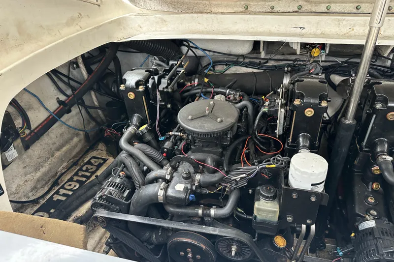 Slide: The Image of Engine compartment of a 2005 Sea Ray 290 SLX boat, showcasing mechanical components. - 18
