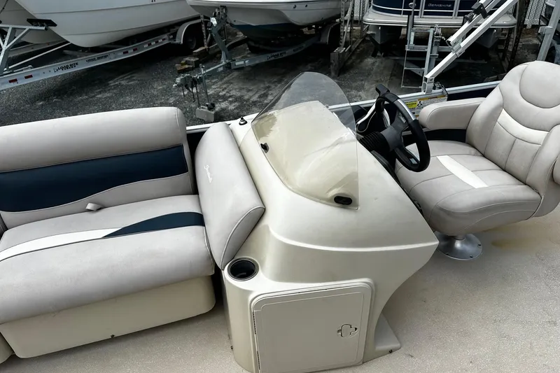 Slide: The Image of 2014 Godfrey Sweetwater 2286 Pontoon interior with steering console and seating. - 5