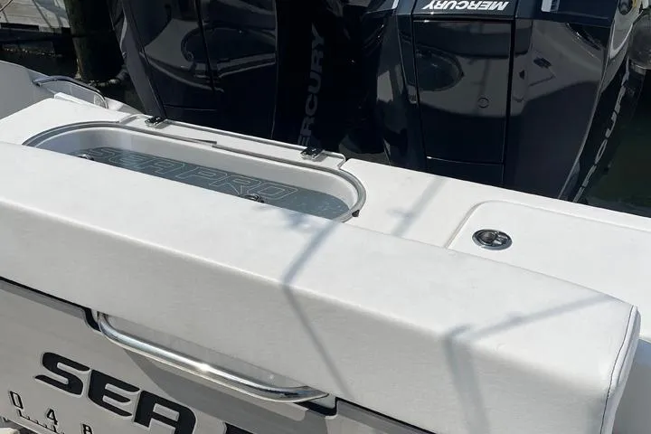 Slide: The Image of 2024 Sea Pro 262 DXL boat with Mercury engines, rear view. - 15