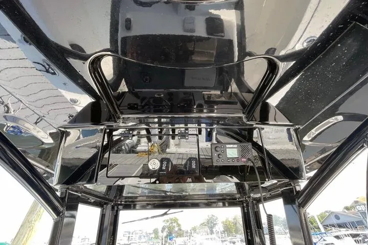 Slide: The Image of 2024 Sea Pro 262 DXL boat interior with sleek black finish and advanced controls. - 6