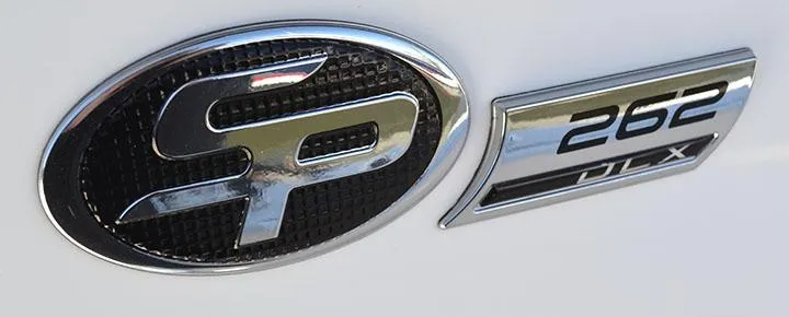 Slide: The Image of 2024 Sea Pro 262 DXL logo and emblem on boat exterior. - 8