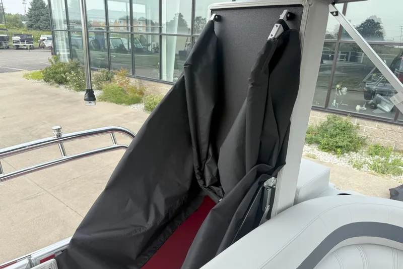 Slide: The Image of 2026 Godfrey Sweetwater 2086 C boat interior with black fabric and metal railing. - 15