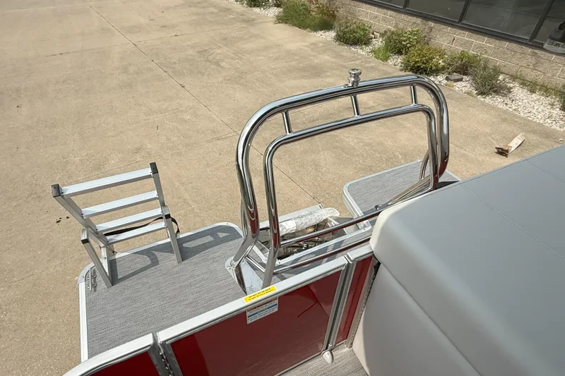 Slide: The Image of 2026 Godfrey Sweetwater 2086 C pontoon boat with beige seating and red paneling. - 20