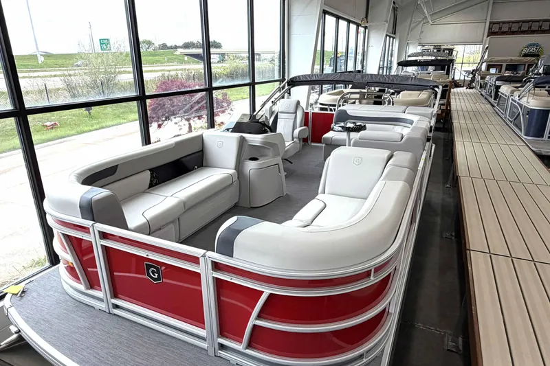 Slide: The Image of 2026 Godfrey Sweetwater 2086 C pontoon boat with spacious seating in showroom. - 21