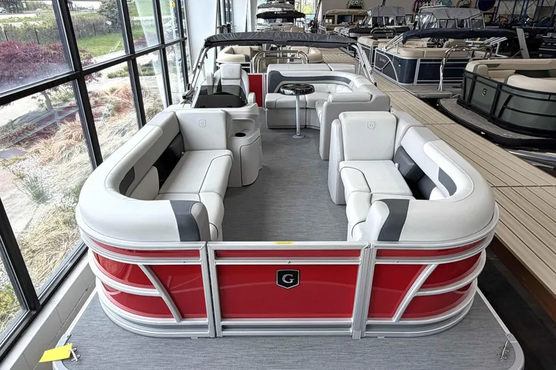 Slide: The Image of 2026 Godfrey Sweetwater 2086 C pontoon boat with red exterior and spacious seating. - 22