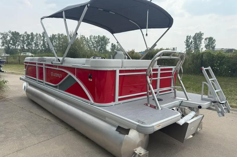 Slide: The Image of 2026 Godfrey Sweetwater 2086 C pontoon boat with red exterior and canopy. - 5