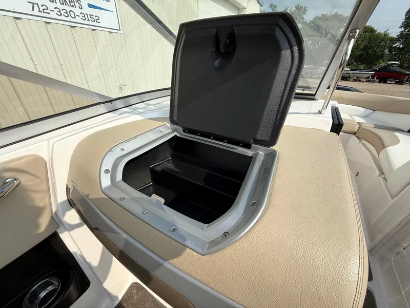 Slide: The Image of Open storage compartment on 2012 Regal 2700 Bowrider boat interior. - 30