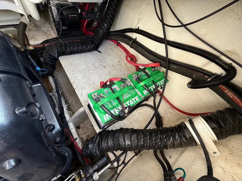 Slide: The Image of Engine compartment of 2012 Regal 2700 Bowrider with Interstate battery and wiring. - 36
