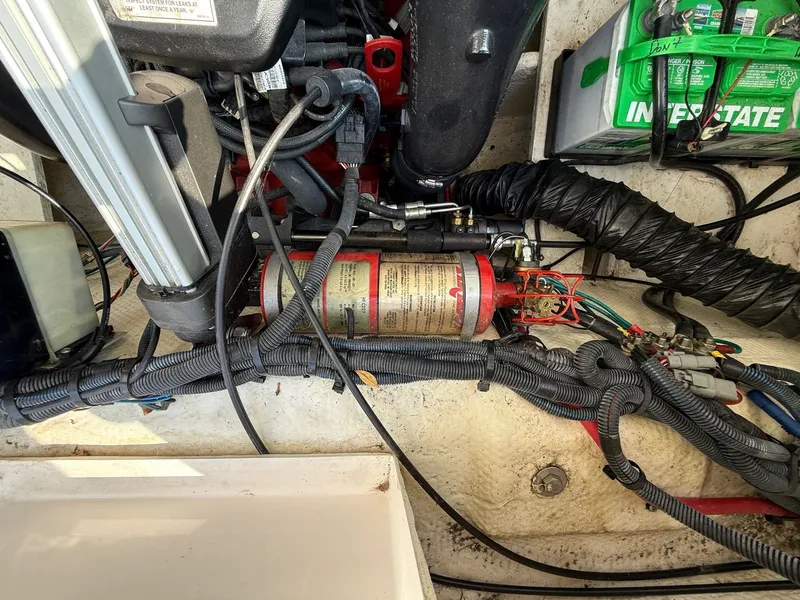 Slide: The Image of Engine compartment of a 2012 Regal 2700 Bowrider with wiring and components visible. - 37