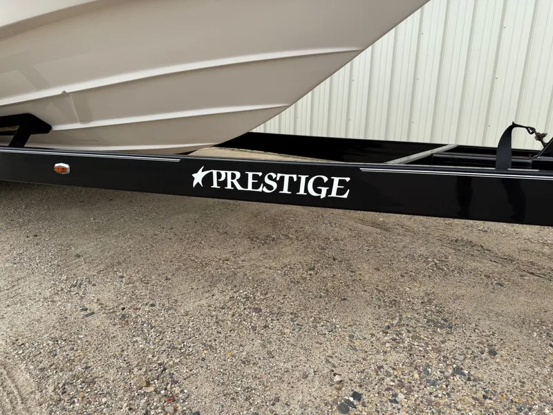 Slide: The Image of 2012 Regal 2700 Bowrider on Prestige trailer, parked on gravel. - 43