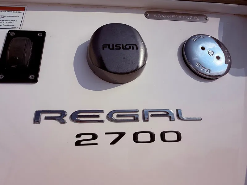 Slide: The Image of 2012 Regal 2700 Bowrider boat branding with Fusion and gas cap details. - 5