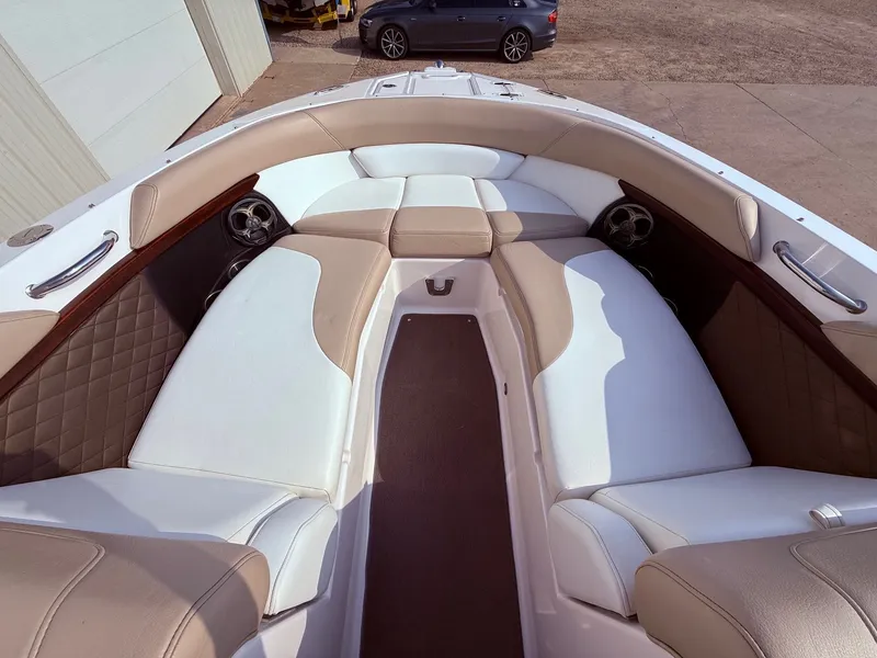 Slide: The Image of 2012 Regal 2700 Bowrider interior with beige and white seating, showcasing spacious design. - 9