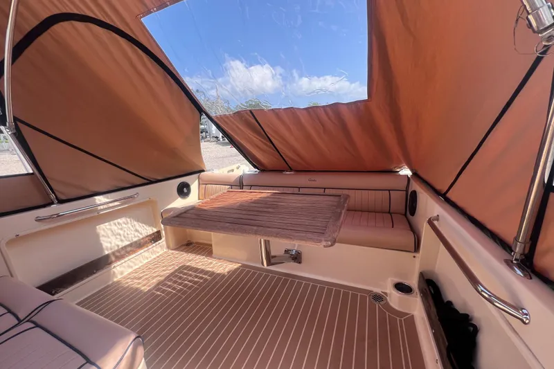 Slide: The Image of Interior of 2018 Rossiter 23 boat with canopy and seating area. - 10