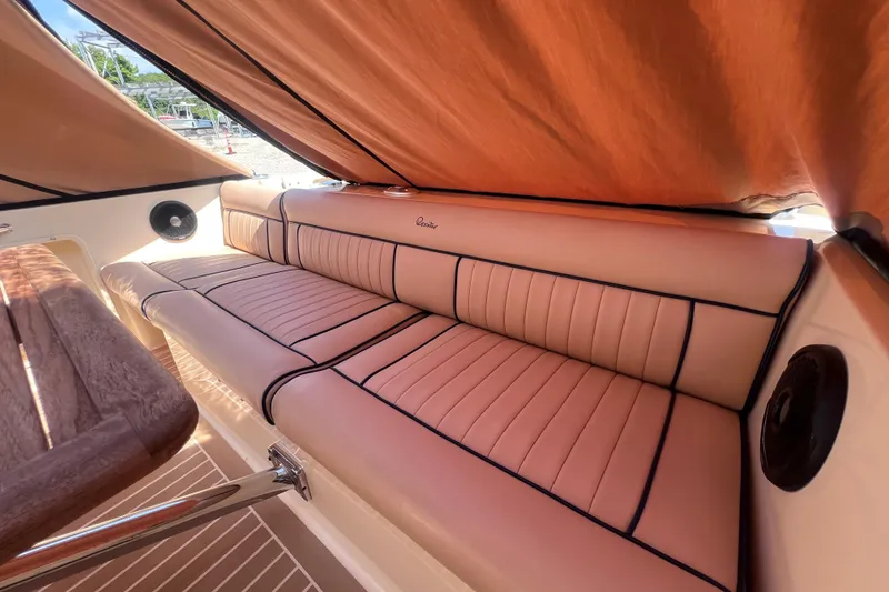 Slide: The Image of Luxurious seating on a 2018 Rossiter 23 boat, featuring elegant tan upholstery. - 9