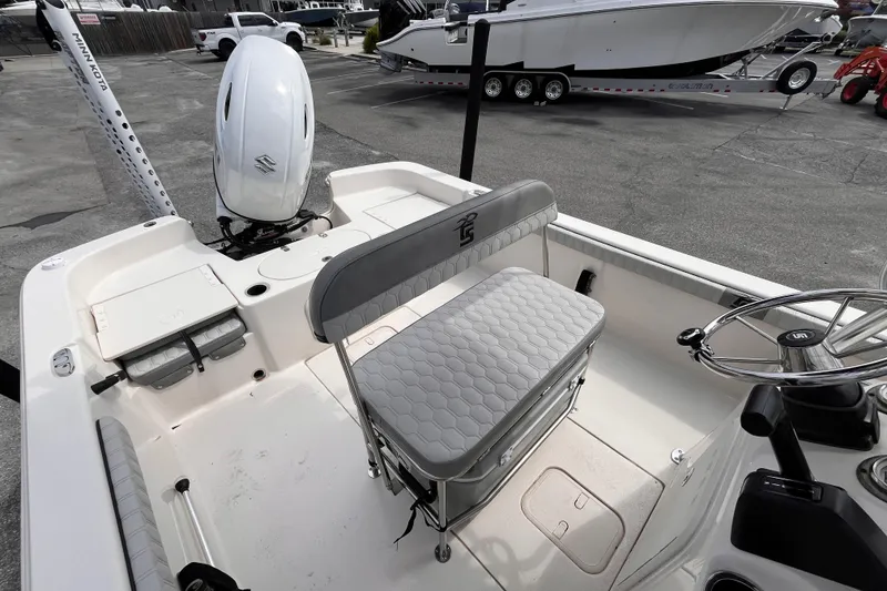Slide: The Image of 2024 Carolina Skiff 21 LS boat interior with seating and steering wheel. - 10