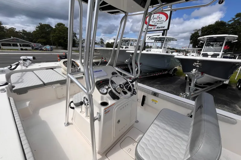 Slide: The Image of 2024 Carolina Skiff 21 LS boat interior with steering console and seating. - 17