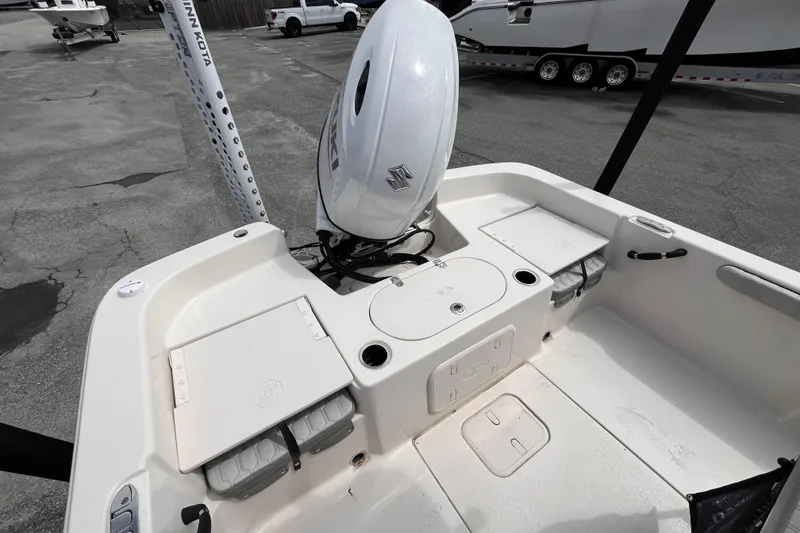 Slide: The Image of 2024 Carolina Skiff 21 LS boat interior with motor and storage compartments. - 6