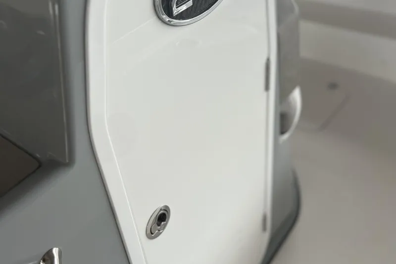 Slide: The Image of 2023 Sea Pro 248 Bay boat interior detail, featuring a sleek white and gray design. - 10
