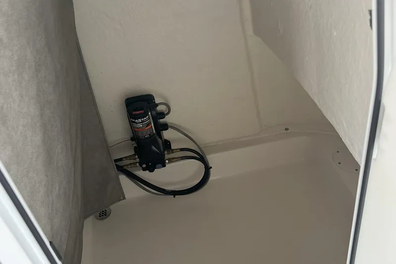 Slide: The Image of Interior view of 2023 Sea Pro 248 Bay boat compartment with installed equipment. - 11