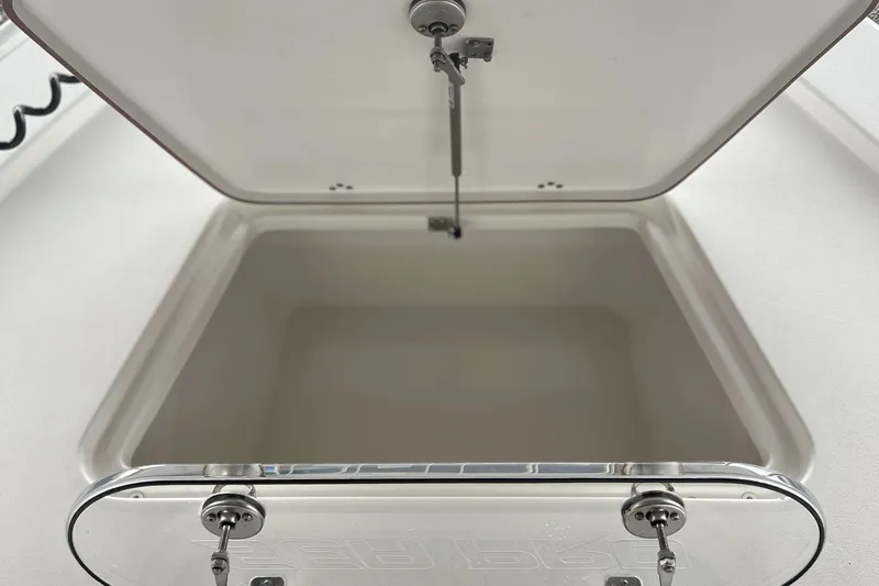 Slide: The Image of Open storage compartment on 2023 Sea Pro 248 Bay boat. - 14