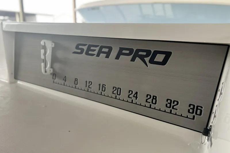 Slide: The Image of 2023 Sea Pro 248 Bay boat with measurement scale on deck. - 9