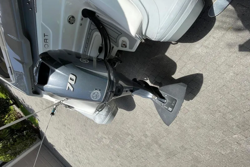 Slide: The Image of Outboard motor on Flexboat Flex 450, parked on a paved surface. - 13