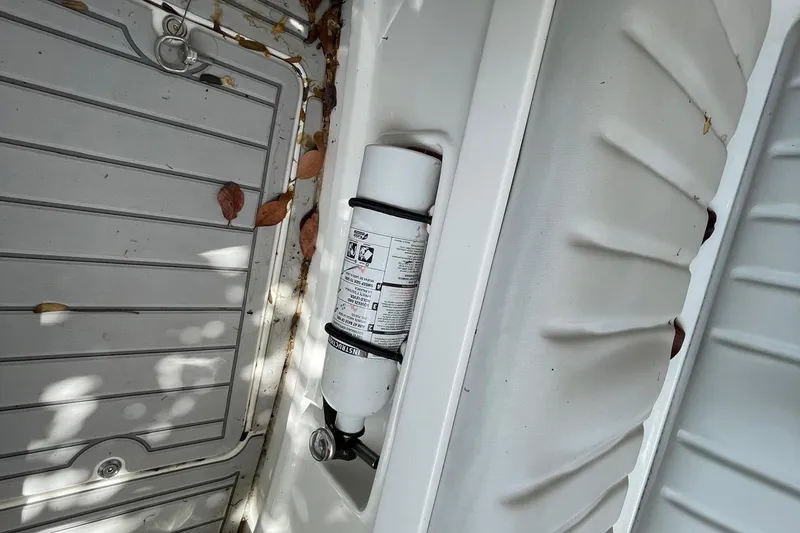 Slide: The Image of Flexboat Flex 450 interior with fire extinguisher and scattered leaves. - 15