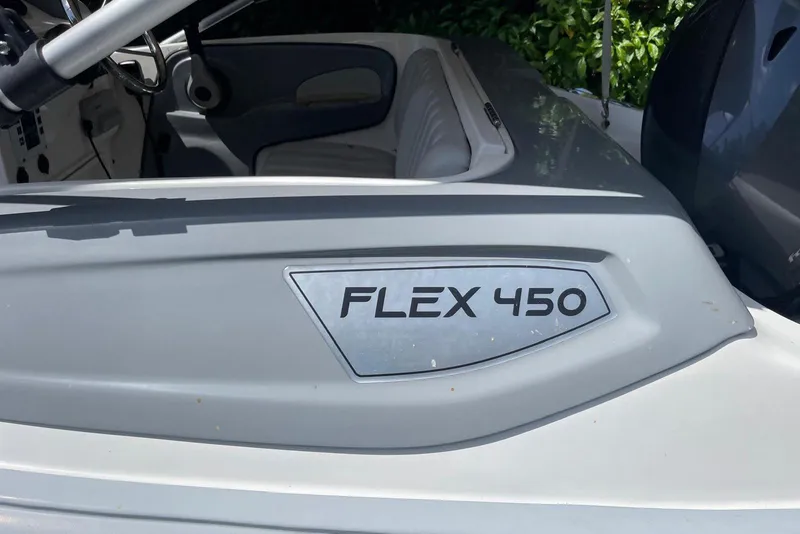 Slide: The Image of Flexboat Flex 450 interior with steering wheel and seating, showcasing sleek design. - 2