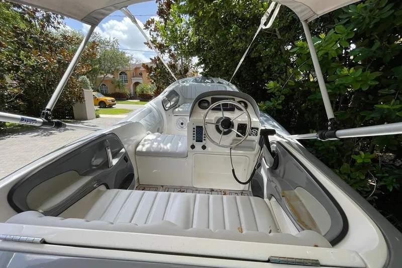 Slide: The Image of Interior view of a Flexboat Flex 450, showcasing steering wheel and seating. - 4