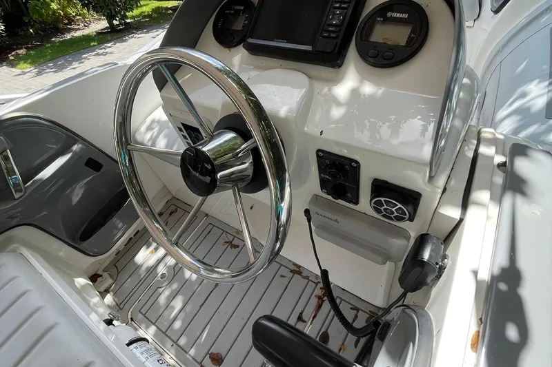 Slide: The Image of Steering console of Flexboat Flex 450 with Yamaha controls and navigation equipment. - 7