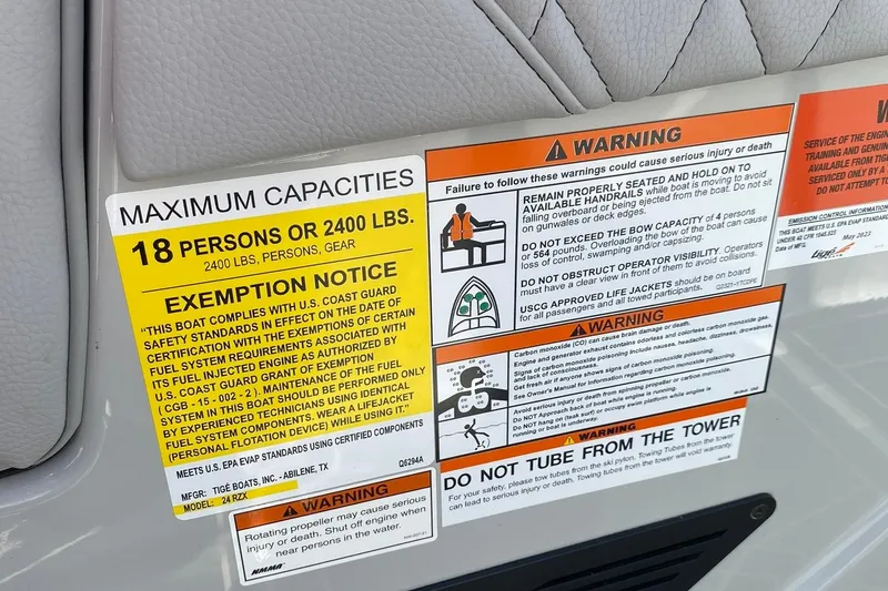 Slide: The Image of 2023 Tigé 24RZX boat capacity and safety warning labels, maximum 18 persons or 2400 lbs. - 10