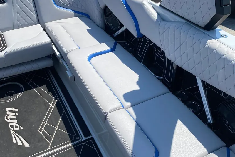 Slide: The Image of 2023 Tigé 24RZX boat interior with luxurious seating and stylish design. - 12
