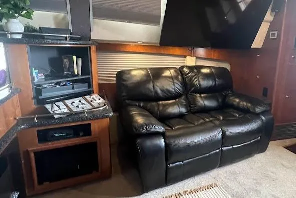 Slide: The Image of Luxurious interior of 2000 Carver 506 Motor Yacht with leather seating and elegant decor. - 14