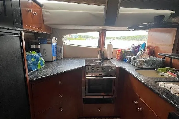 Slide: The Image of Luxurious interior of 2000 Carver 506 Motor Yacht with leather seating and entertainment system. - 16