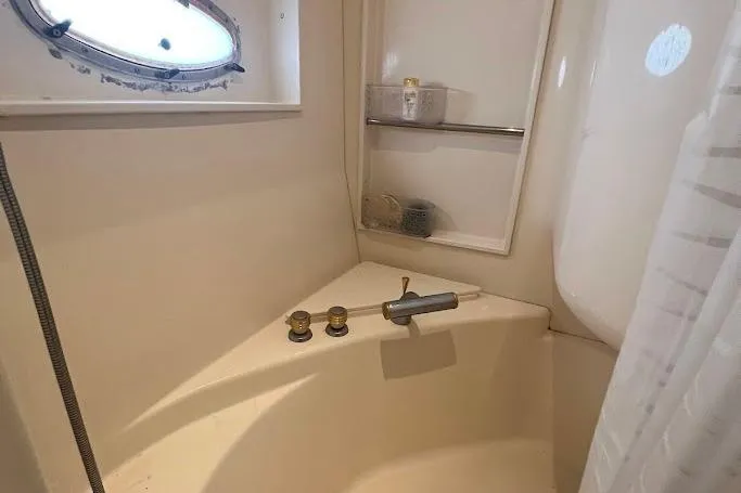 Slide: The Image of Luxurious bedroom interior of 2000 Carver 506 Motor Yacht with striped bedding. - 23