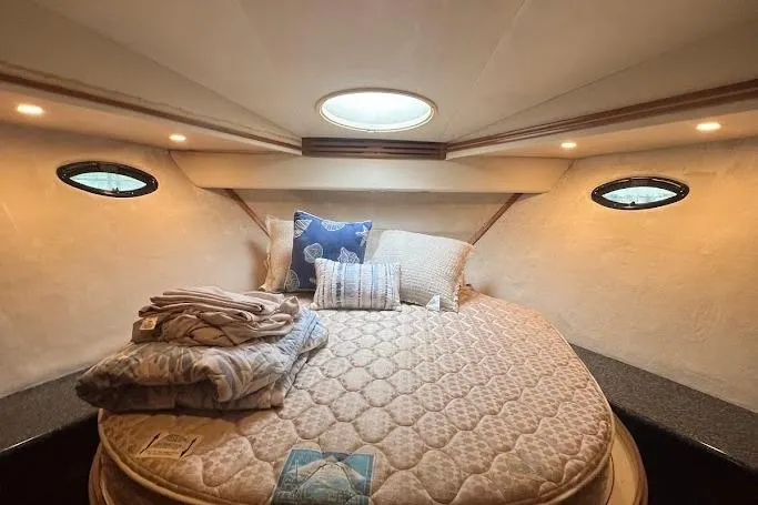 Slide: The Image of Interior of 2000 Carver 506 Motor Yacht with twin beds and cozy decor. - 28
