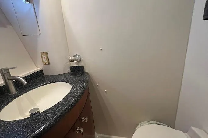 Slide: The Image of Bathroom interior of 2000 Carver 506 Motor Yacht with porthole window. - 29