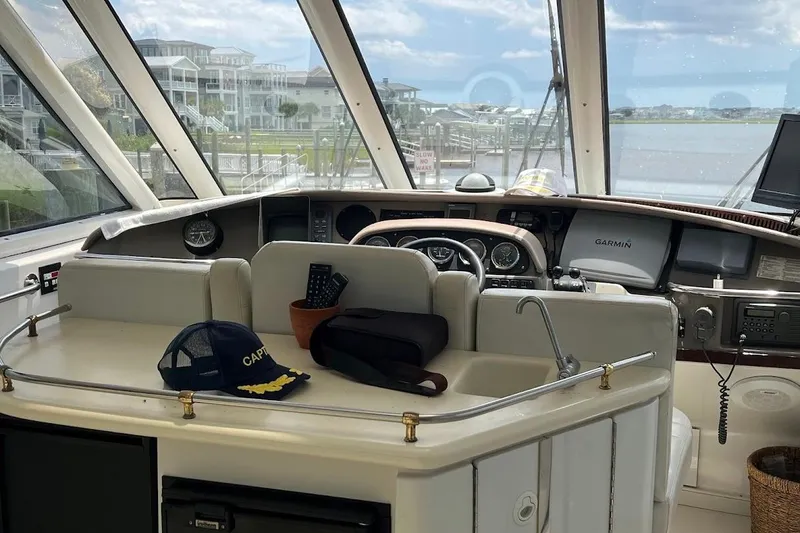 Slide: The Image of Helm of 2000 Carver 506 Motor Yacht with panoramic marina view. - 4