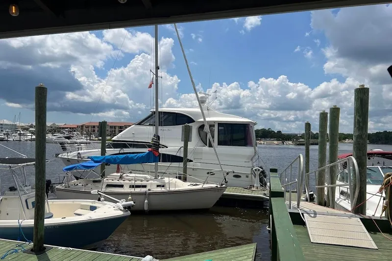 Slide: The Image of Engine compartment of a 2000 Carver 506 Motor Yacht, showcasing mechanical components and wiring. - 41
