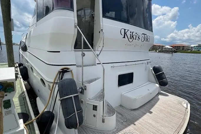 Slide: The Image of Engine room of a 2000 Carver 506 Motor Yacht, showcasing mechanical components and hoses. - 43