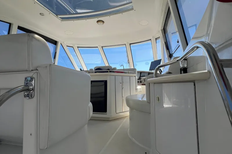 Slide: The Image of Carver 506 Motor Yacht 2000 deck with Magma grill cover, overlooking water. - 45