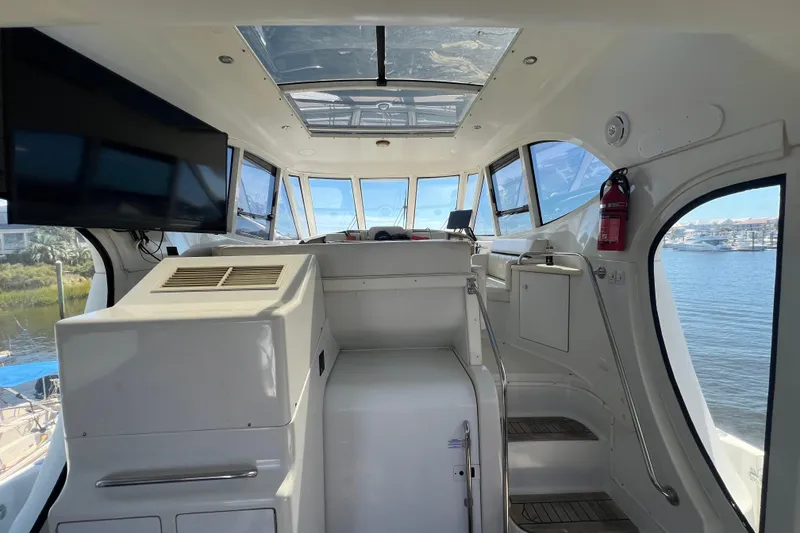 Slide: The Image of Side view of a 2000 Carver 506 Motor Yacht docked at a marina. - 46