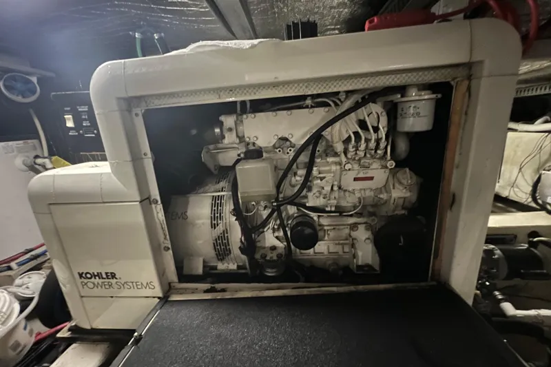 Slide: The Image of Carver 506 Motor Yacht 2000, deck area with wooden flooring and white railing. - 47