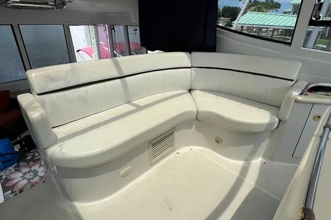Slide: The Image of Interior of 2000 Carver 506 Motor Yacht with white seating and skylight. - 7