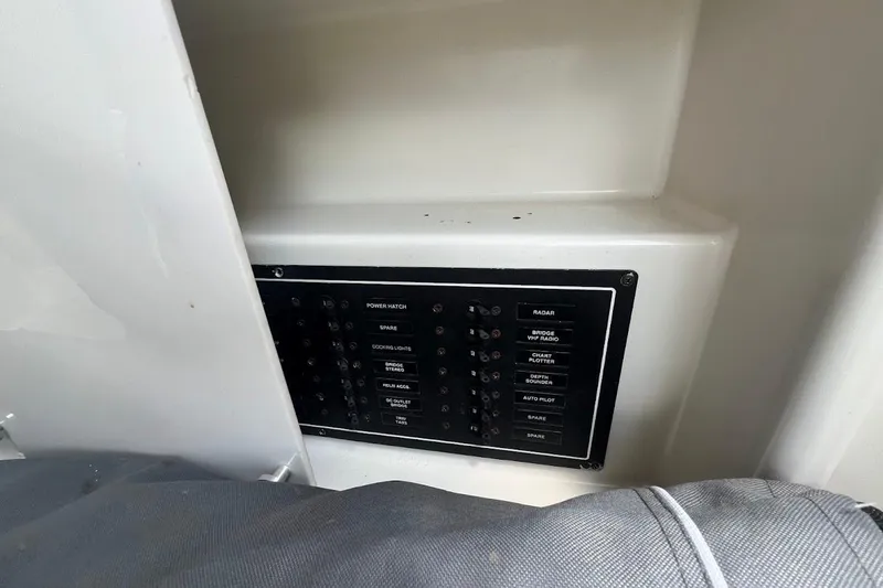 Slide: The Image of Interior seating area of 2000 Carver 506 Motor Yacht with white leather upholstery. - 8