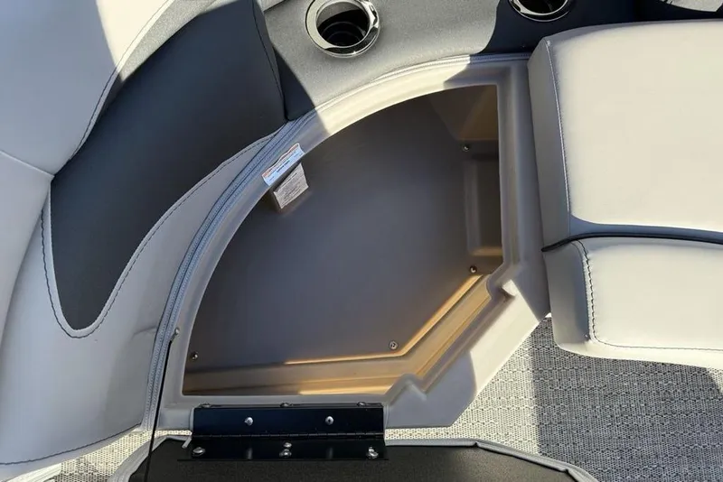 Slide: The Image of Interior storage compartment of 2025 Barletta A20UC boat with cup holders. - 10