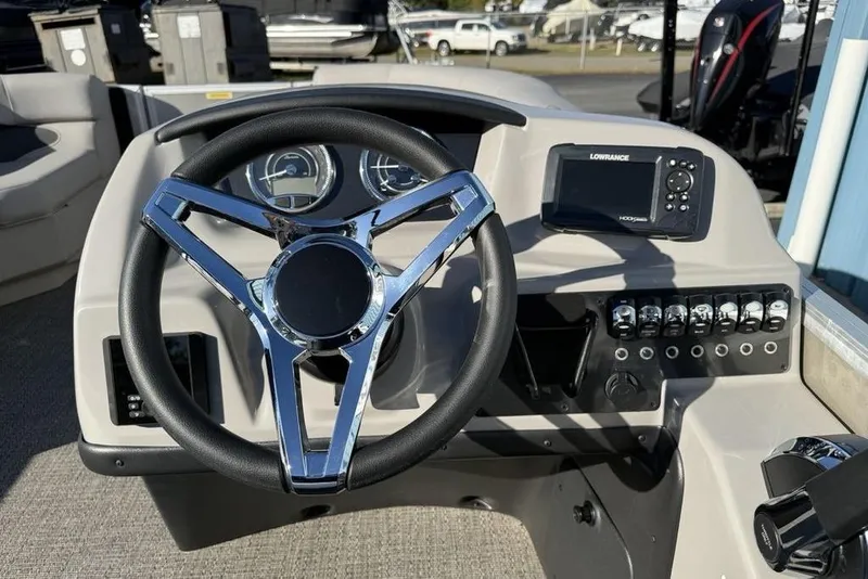 Slide: The Image of Steering wheel and dashboard of 2025 Barletta A20UC boat with navigation system. - 12